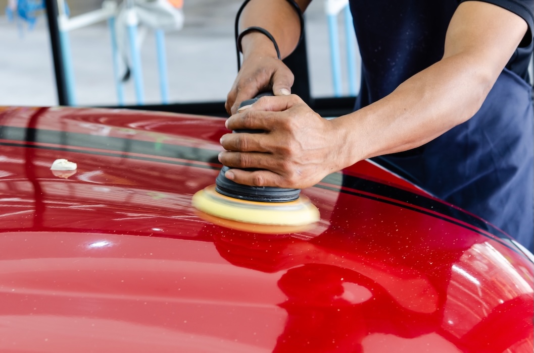 Buffing red car with black stripes and polisher 2026 03 20 03 16 04 utc.jpg