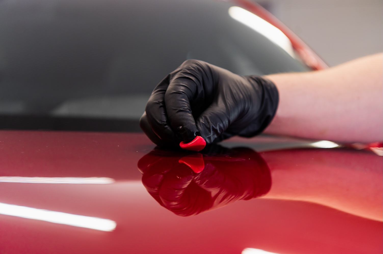 Hand in glove polishing car s exterior surface 2026 03 11 00 55 25 utc.jpg